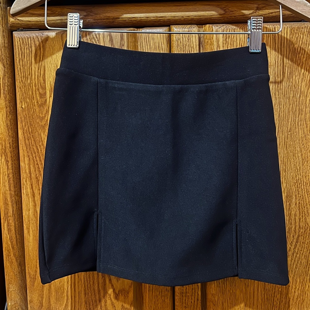 Black double slit mini skirt.